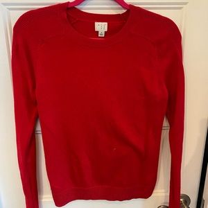 A new day red sweater
